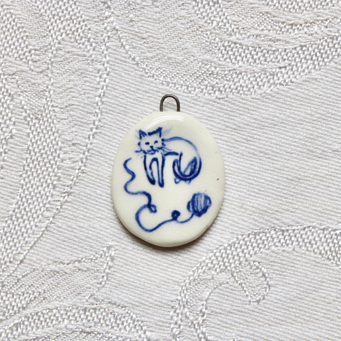 Cat With Yarn Charm